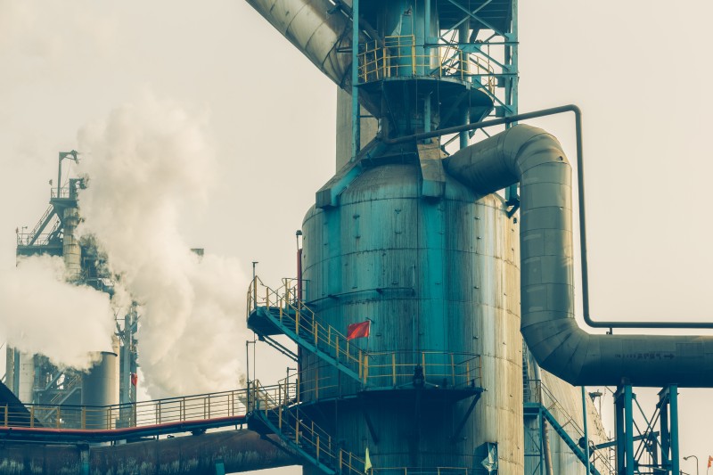Industrial cooling tower and large-scale piping system at a manufacturing facility