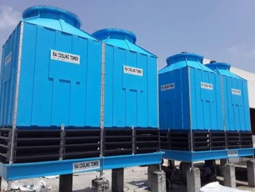 Square FRP Cooling Towers with blue fiberglass bodies and black air intake louvers installed on concrete support pillars