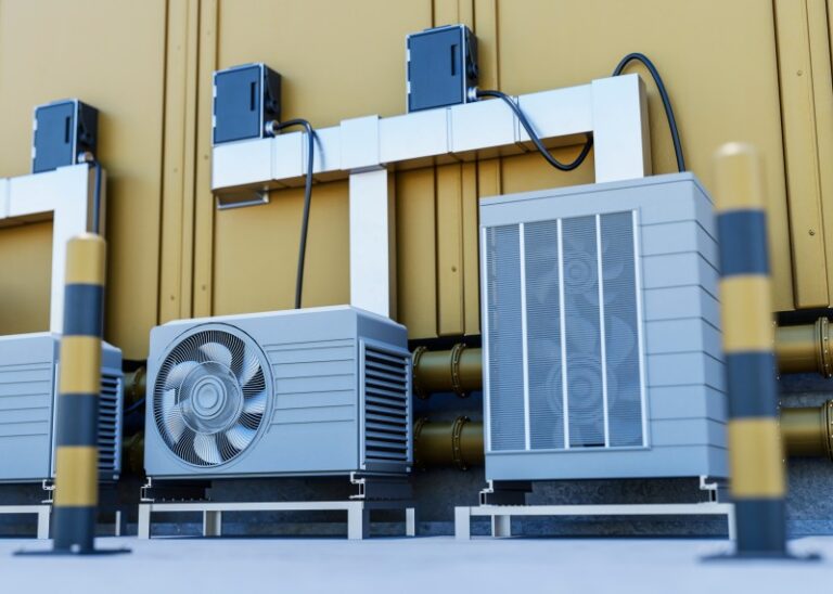 Square FRP Cooling Towers with industrial HVAC units, pipes, and electrical connections installed outdoors.