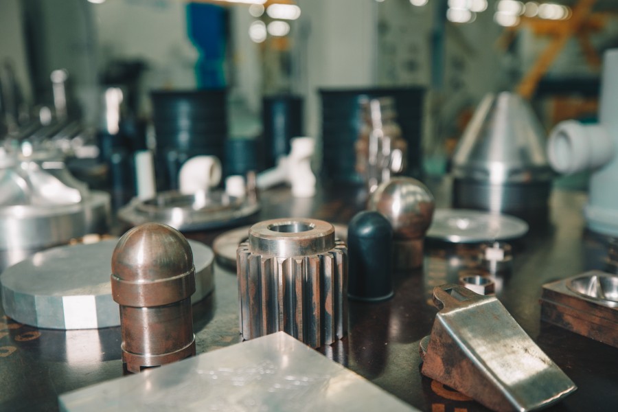 Cooling Tower Spare Parts including precision-engineered metal components and machined industrial parts displayed in a manufacturing workshop
